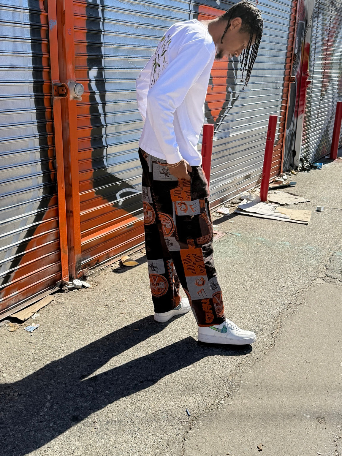 Orange printed cotton cargo pants — fit and detail