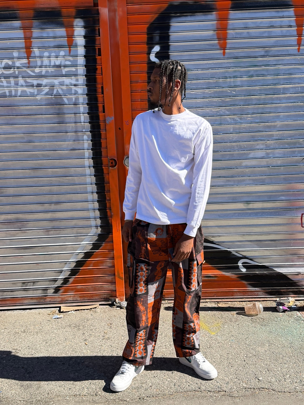 Model wearing orange printed cotton cargo pants