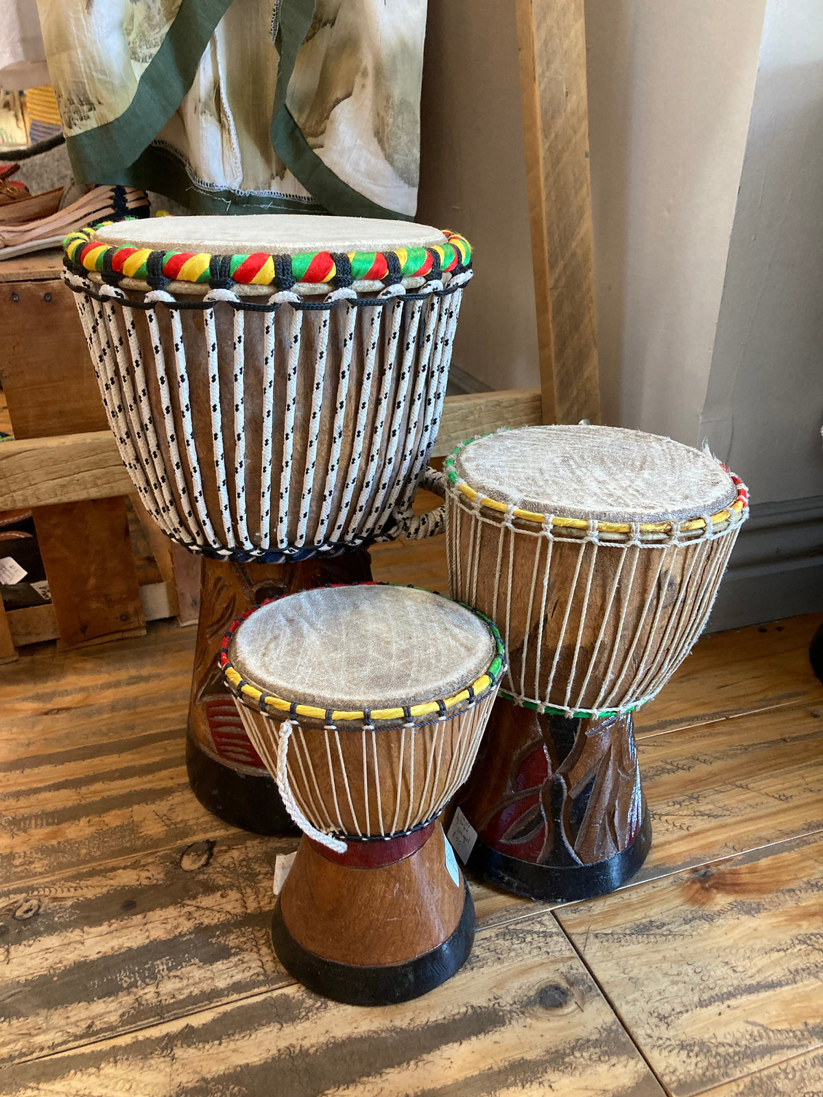 Teranga Africa/Choose Senegal hand-carved wooden djembe drums with goatskin heads and colorful braided trim