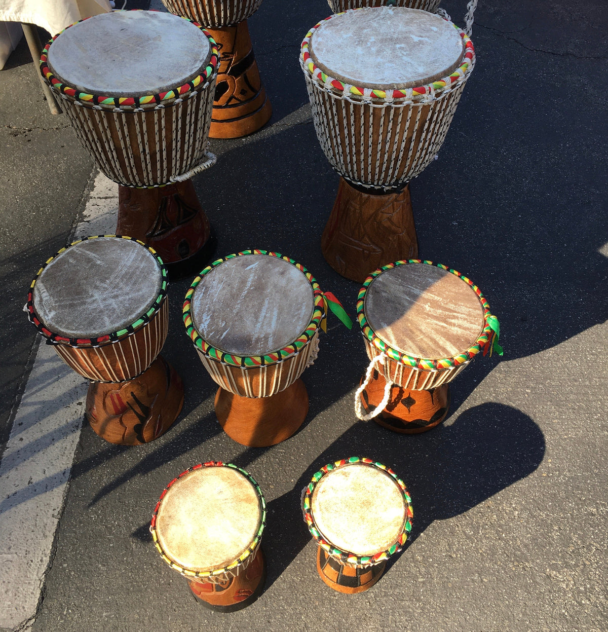 Teranga Africa/Choose Senegal hand-carved wooden djembe drums with goatskin heads and colorful braided cord trim